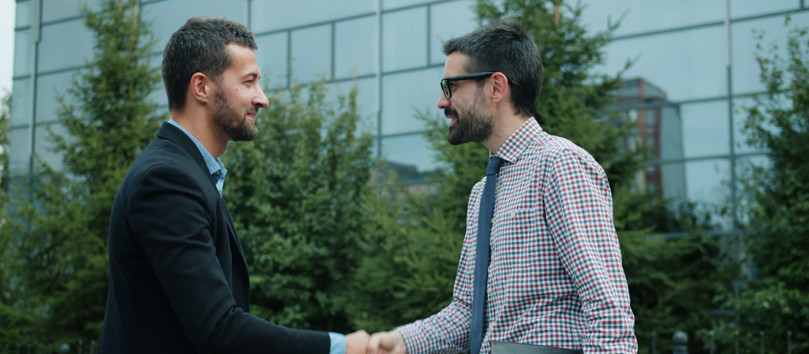 Business owners shaking hands on a local advertising deal