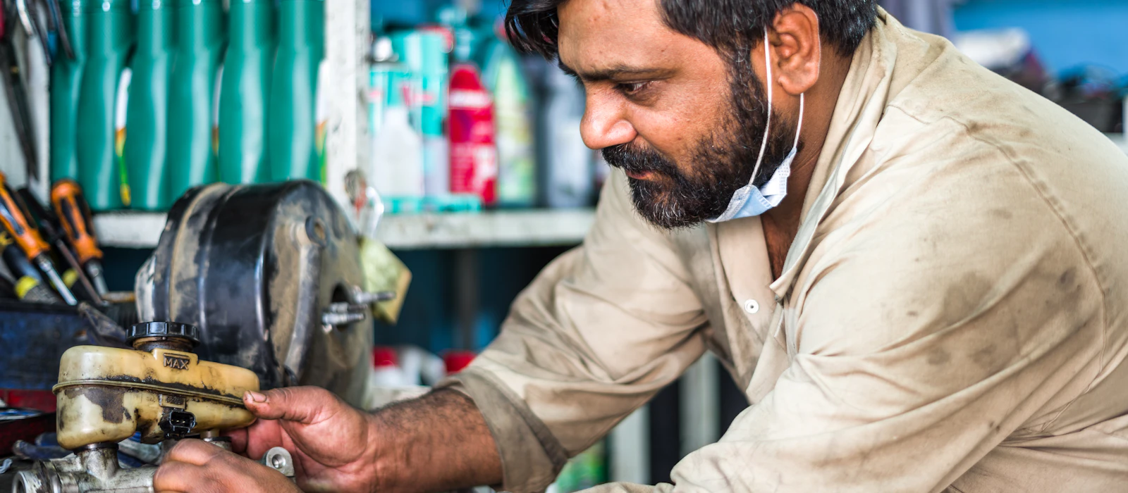 Auto electrician at work in a workshop